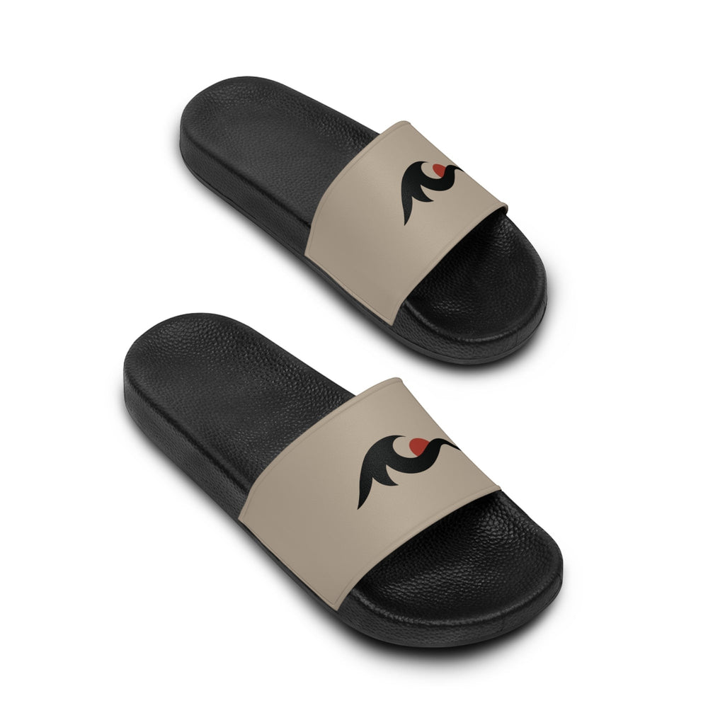 Redcastaway beige and black PVC foam slides with a black logo and red dot detail. Comfortable, quick-drying, and easy to clean.