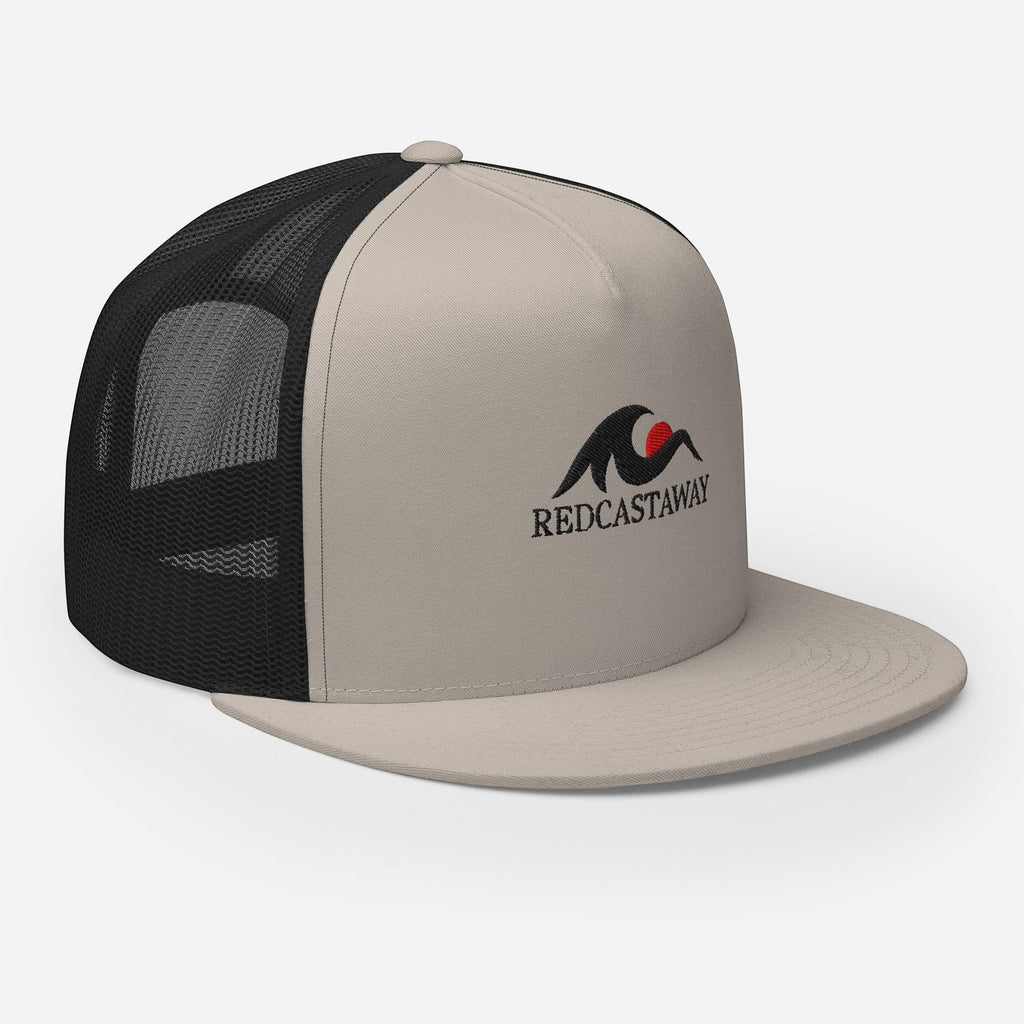 Redcastaway trucker cap in beige with black mesh back and embroidered logo. Features a flat bill and snapback closure.
