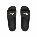 Redcastaway black PVC foam slides with white and red logo on strap. Comfortable, quick-drying, and easy-to-clean.
