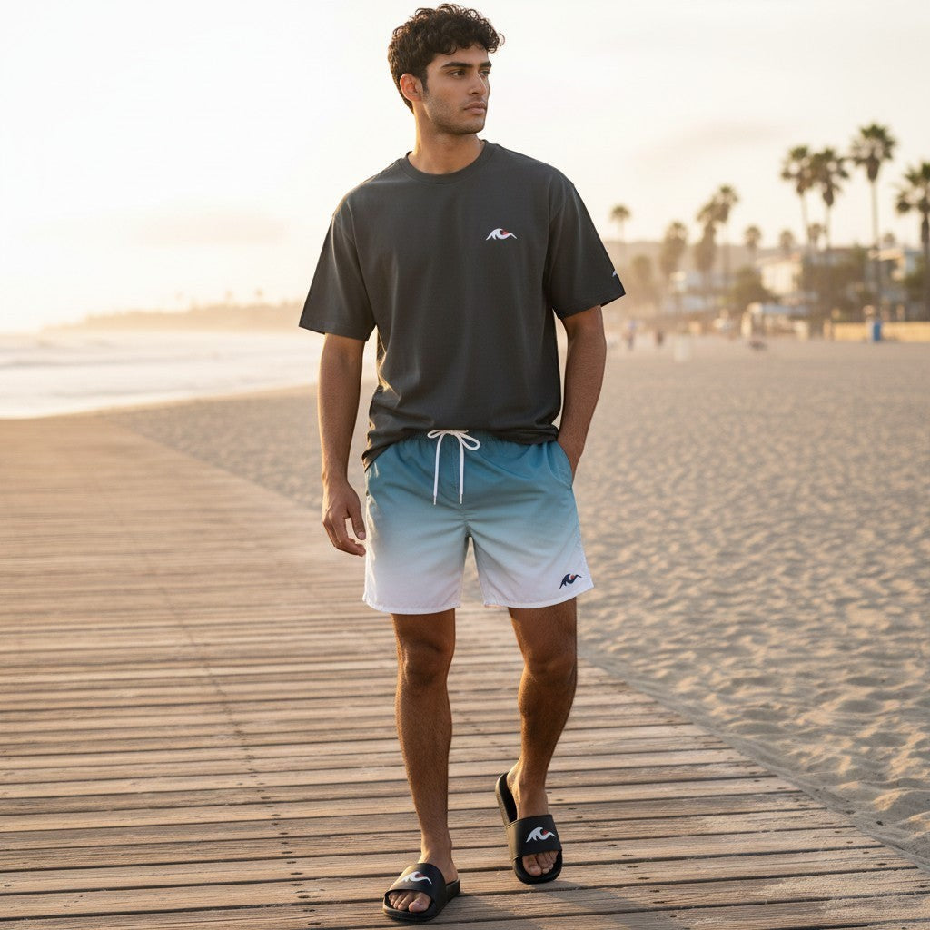 Redcastaway men's black slides with white wave logo, ideal for beachwear.