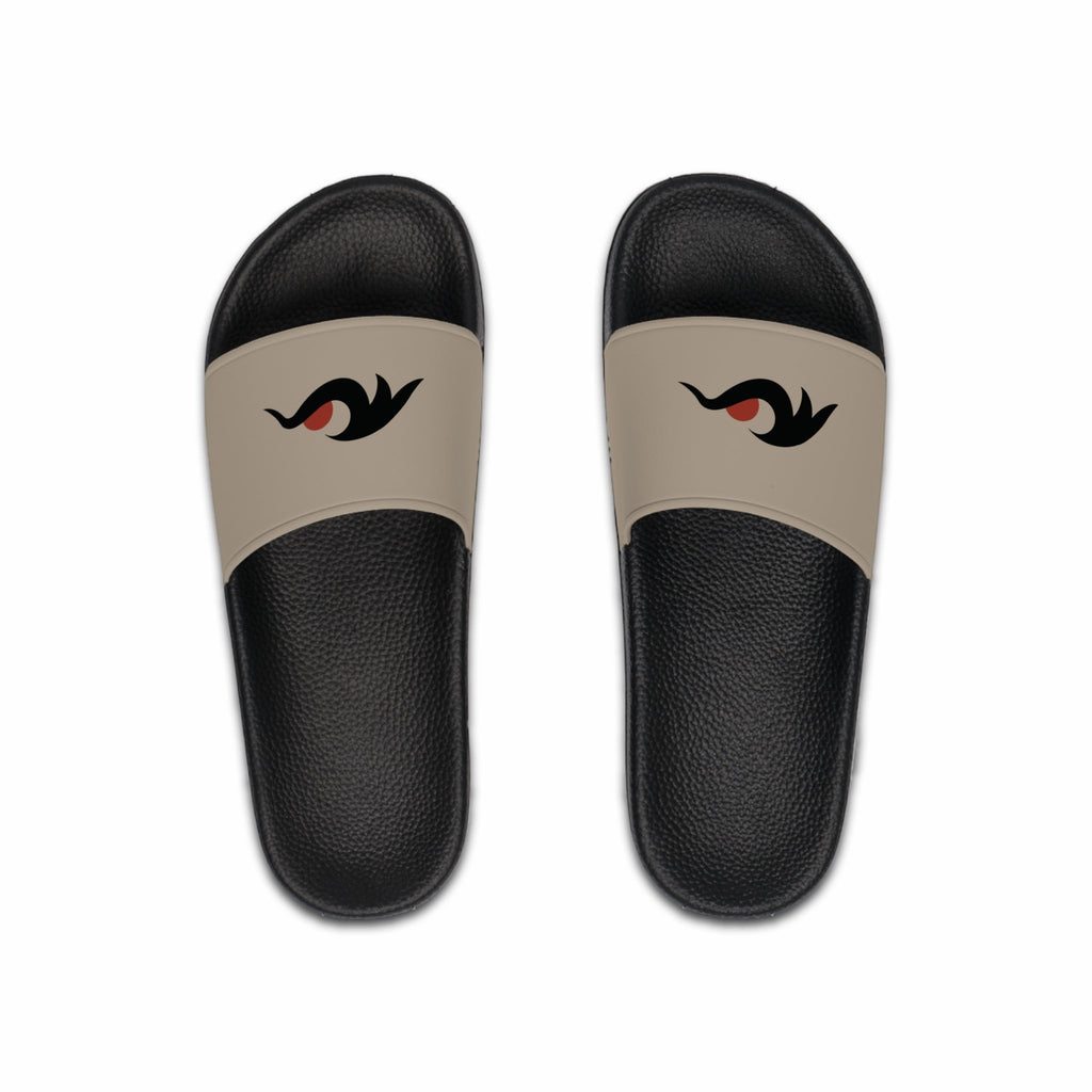 Redcastaway black PVC foam slides with a tan strap featuring a black and red eye graphic. Comfortable, quick-drying, and easy to clean.