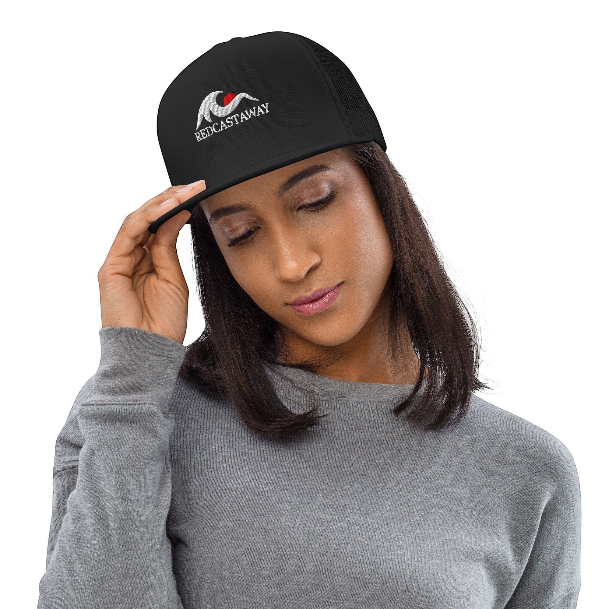 Redcastaway black trucker cap with flat bill and embroidered logo. Cotton, nylon, polyester blend with snapback closure.