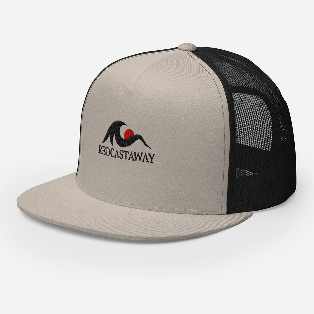 Redcastaway Drift Trucker Cap in beige with black mesh back, flat bill, and embroidered logo. Cotton, nylon, polyester blend.