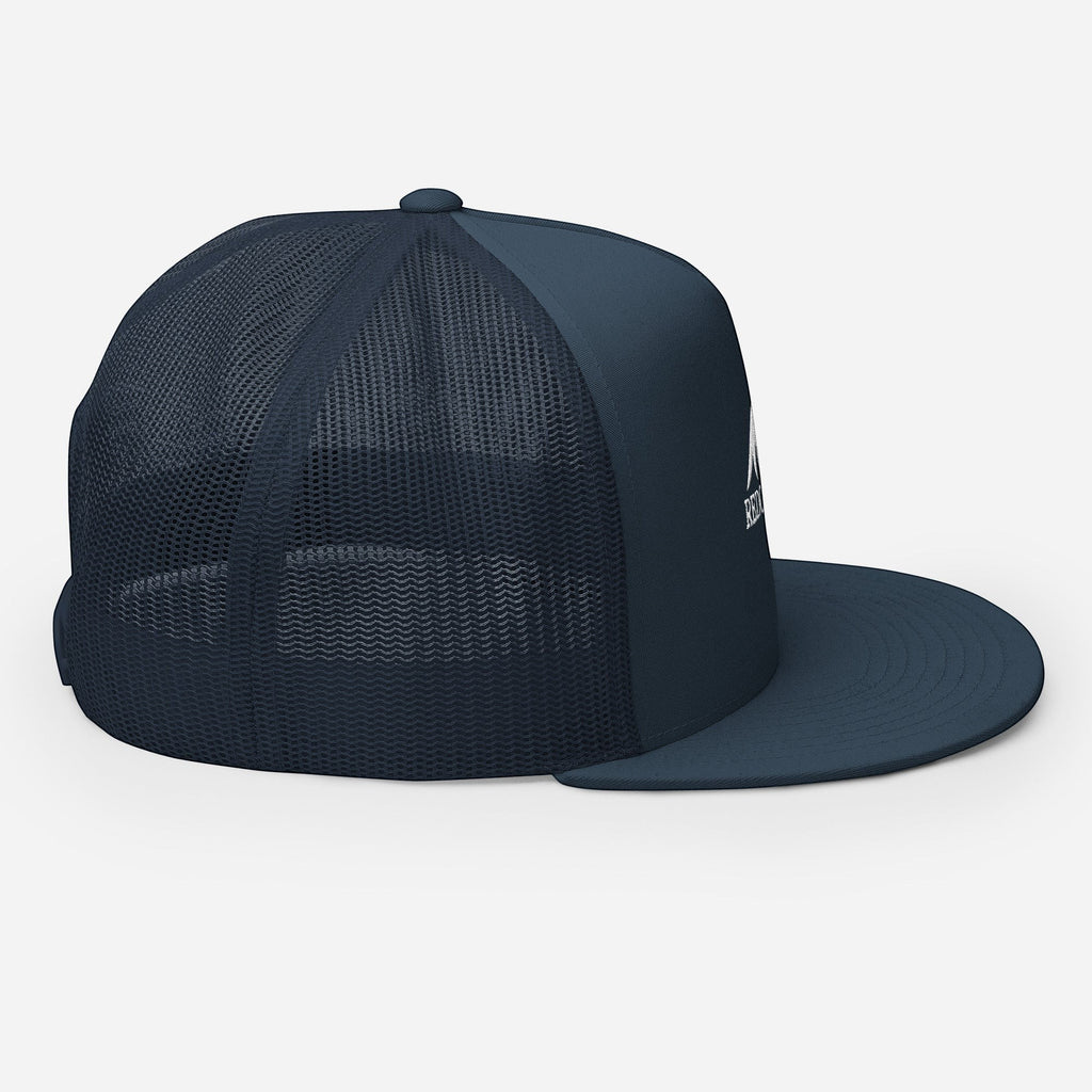 Redcastaway navy blue trucker cap with mesh back and flat bill. Features a white logo on the front.