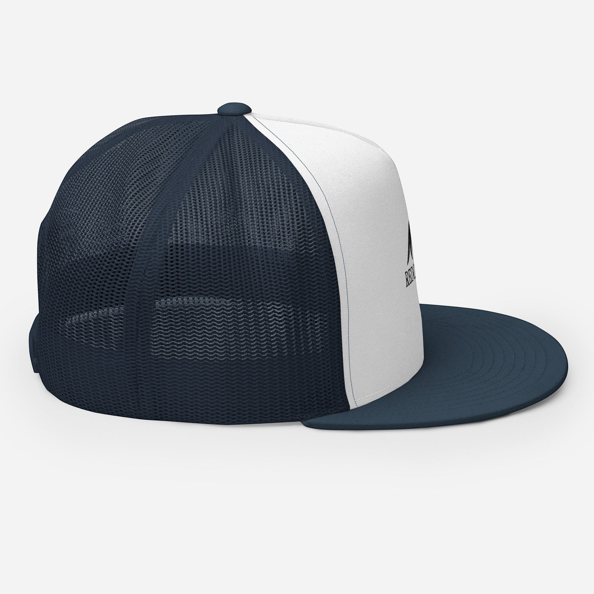 Redcastaway trucker cap with white front panel and navy mesh back. Features a flat bill and snapback closure.