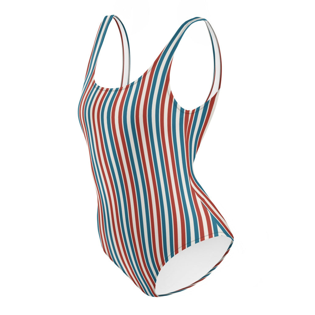 Redcastaway™ one-piece swimsuit with red, white, and blue vertical stripes. Features a scoop neckline and low scoop back.