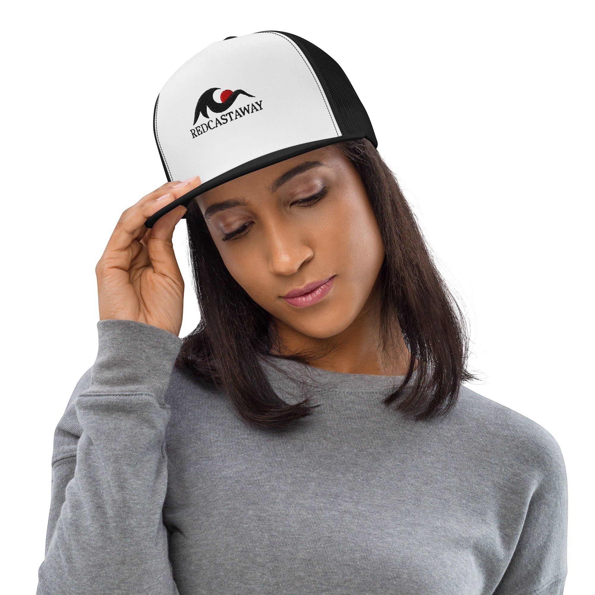 Redcastaway™ white and black trucker cap with flat bill and snapback closure, featuring the brand logo.