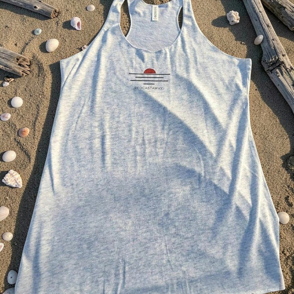 Redcastaway™ women's light blue heathered racerback tank top with a sunset graphic and raw edge seams. Made from a polyester, cotton, and rayon blend.